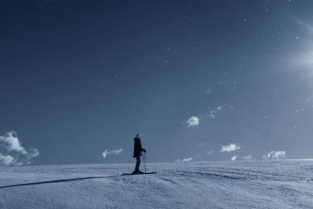 istock Fit young woman posing on ski slopes 945363962