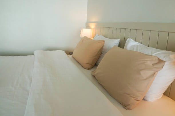 istock close up cozy pillow on white double bed in minimal master bedroom 945372738