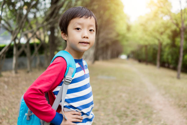 istock Cute children playing in the park 945373574
