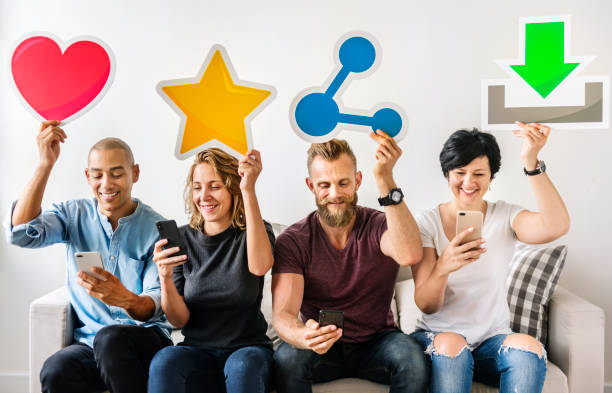 istock People holding an social media icon 945373998