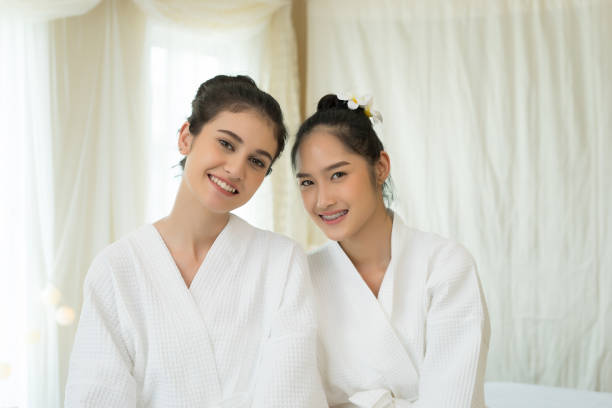istock Two beautiful women relaxing before massage talking in spa 945374330