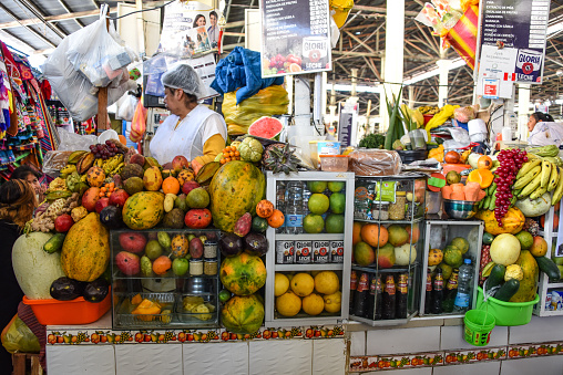 CUZCO, PERU - March 29, 2018: Mercado San Pedro, a sprawling indoor and outdoor market where locals shop for fresh produce and groceries.