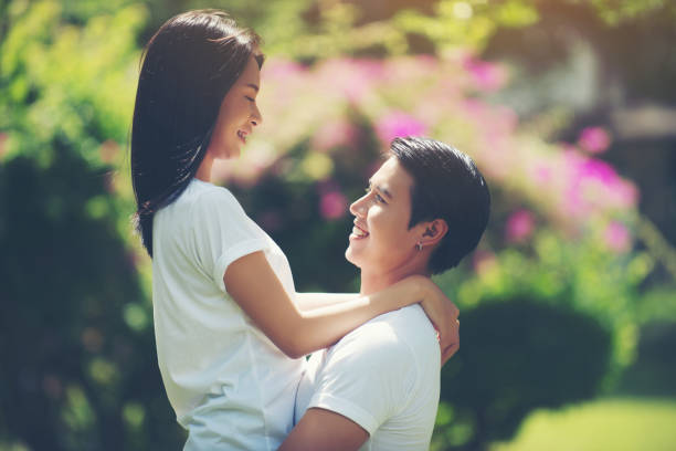istock Young Couple hugging together during walking relaxing together. 945377840