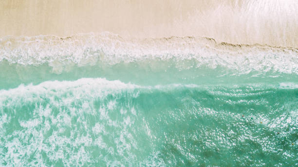 istock white sand and blue ocean. waves 945380980