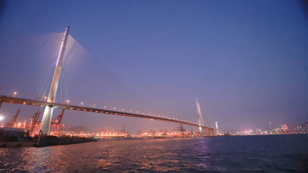 istock night view at Stonecutters Bridge, Hong Kong. 945388328