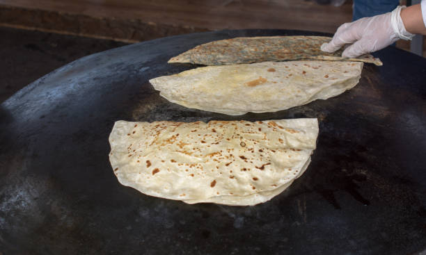 istock Making of traditional turkish gozleme pancake 945390956