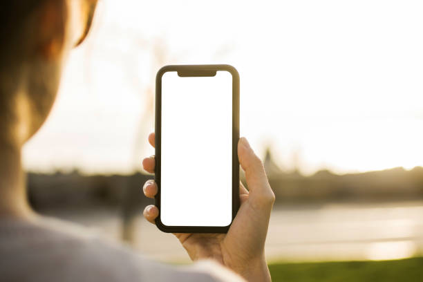 istock Woman Hand Holding Mobile Phone 945398168