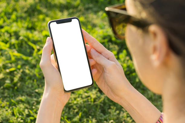 istock Woman Hand Holding Mobile Phone 945398180