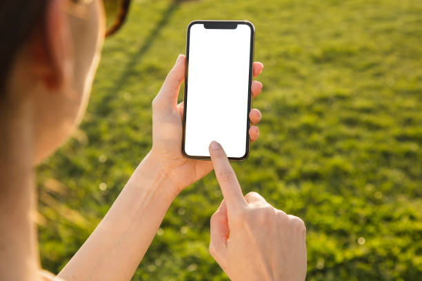 istock Woman Hand Holding Mobile Phone 945398190