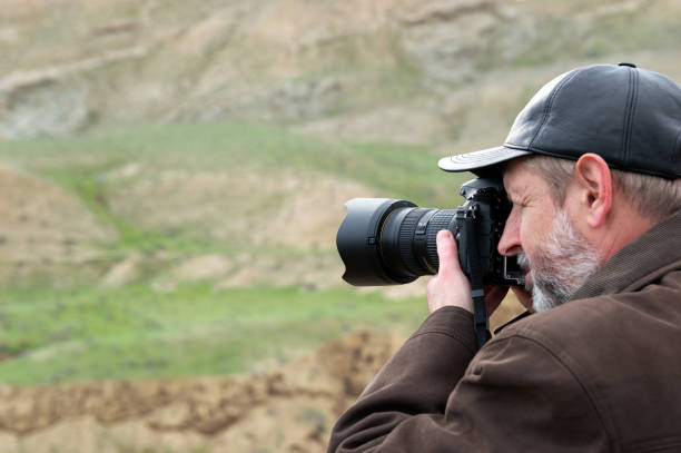 istock Nature photographer in mountains 945398208