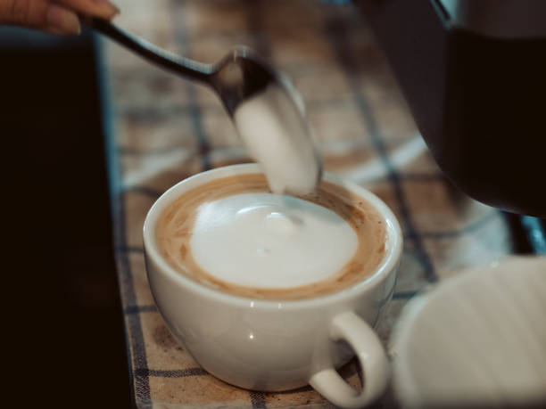 istock Process of making Latte coffee in the coffee shop. 945399022
