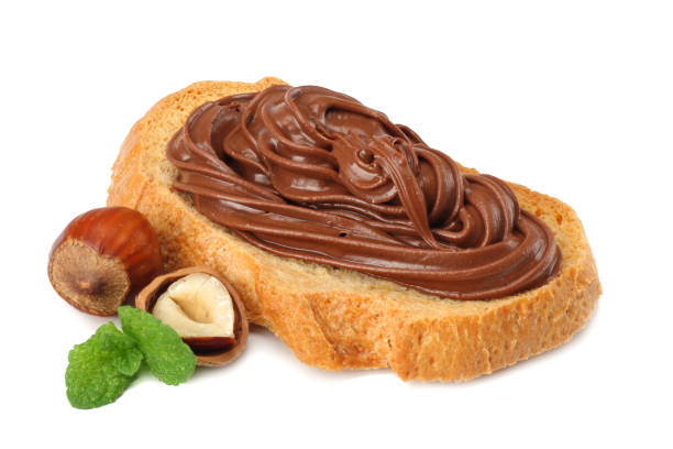 istock Slice of bread with chocolate cream with hazelnut isolated on white background 945404548