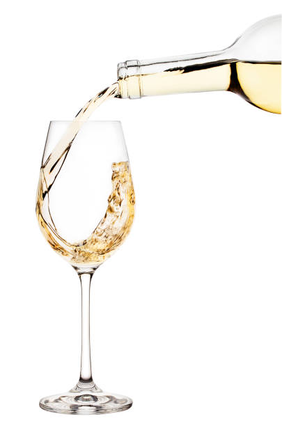 istock White wine is poured into wine glass 945406248