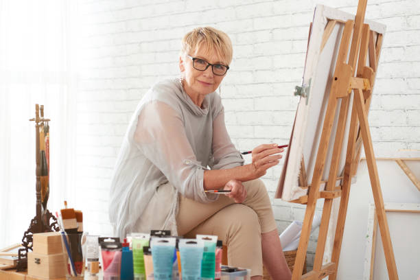 istock Painting cheerful woman 945408972