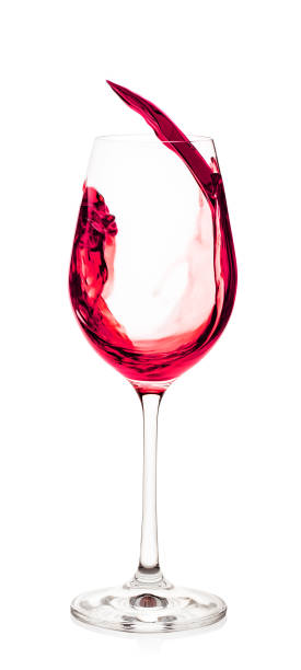 istock Splash of red wine in glass 945409166