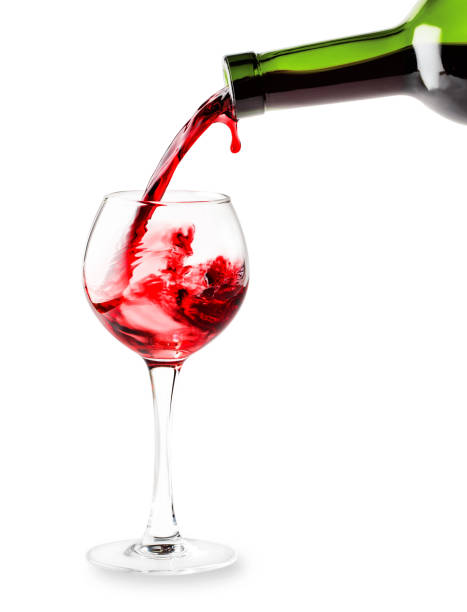 istock Red wine pouring into a glass 945409490