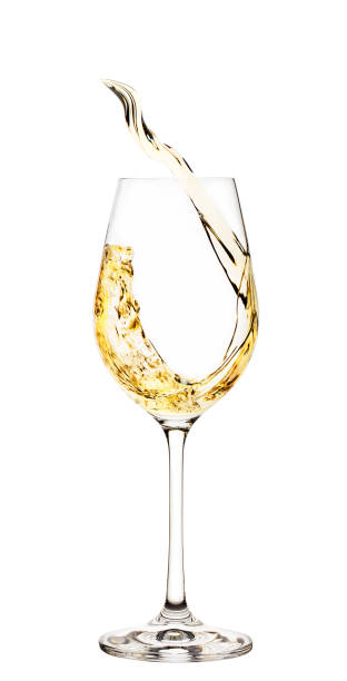 istock Splash of white wine in glass 945409872
