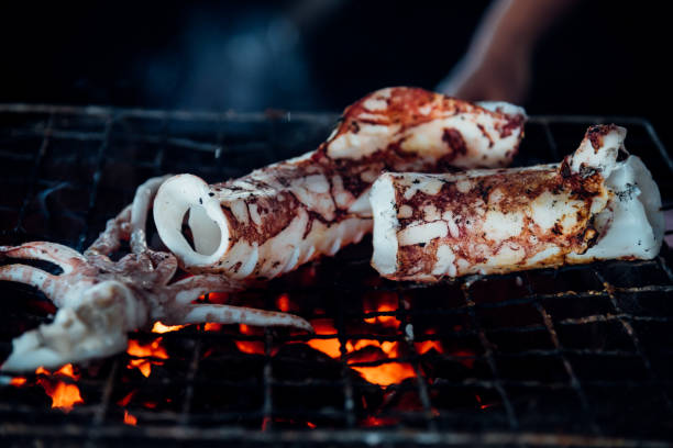 istock Grilled squid or octopus at Thai seafood market 945412538