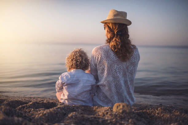istock Mother and son at the beach 945416032
