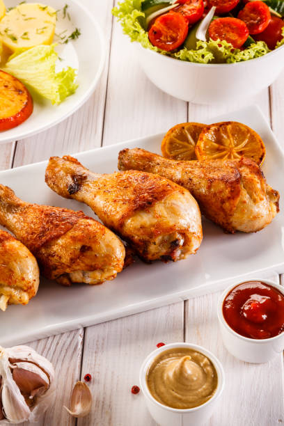 istock Barbecued chicken drumstick with vegetables 945425166