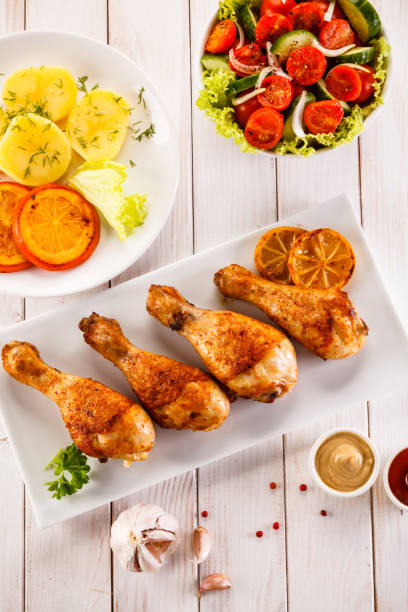istock Barbecued chicken drumstick with vegetables 945427268