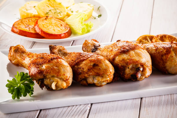 istock Barbecued chicken drumstick with vegetables 945427306