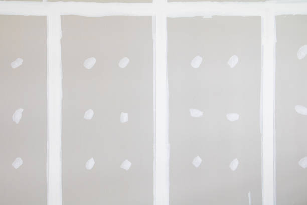 istock gypsum board wall interior decoration of home at construction site with copy space add text 945428056