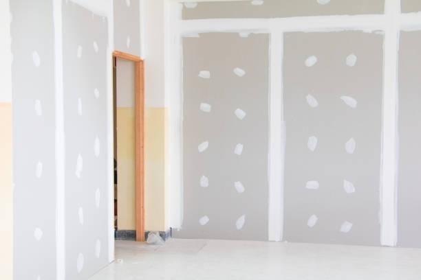 istock gypsum board wall interior decoration of home at construction site with copy space add text 945428076