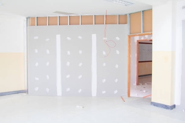 istock gypsum board wall interior decoration of home at construction site with copy space add text 945428082