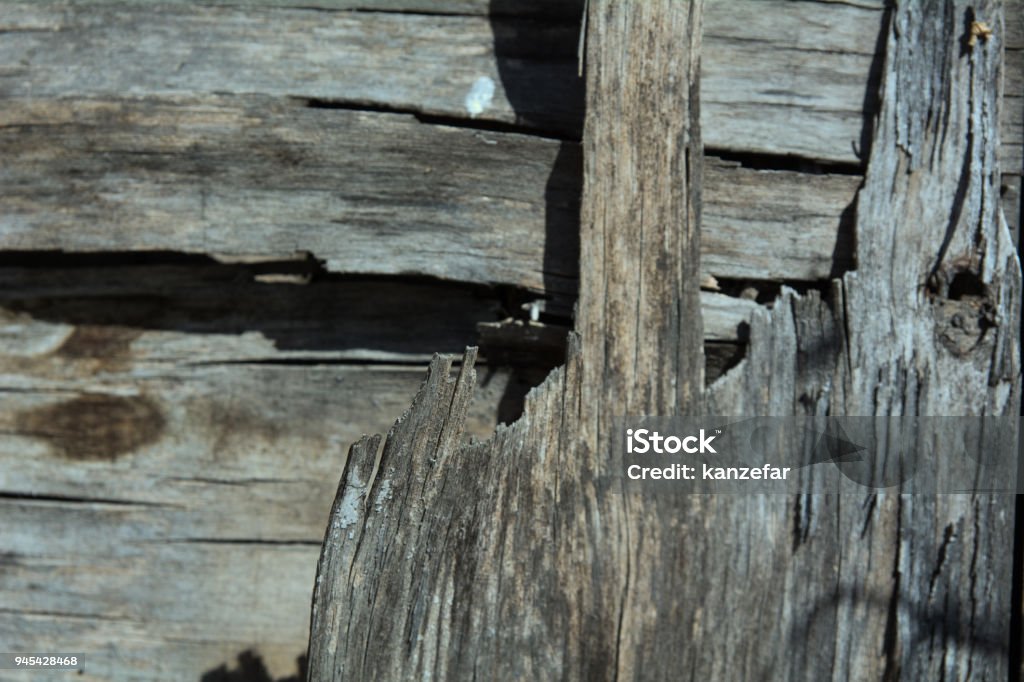 Background is an old wooden rough layered plywood Background is an old wooden rough layered plywood. Abstract Stock Photo