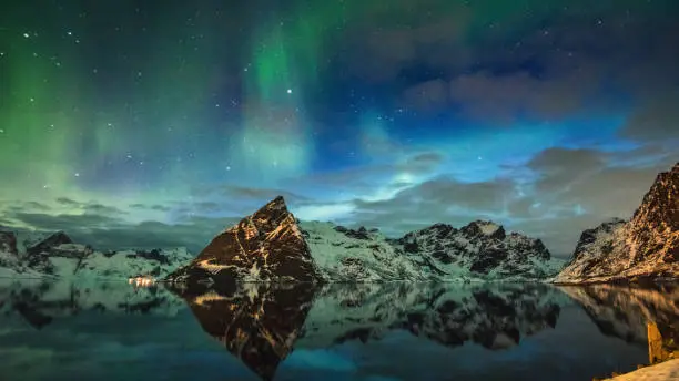 view of reine at lofoten with the aurora borealis