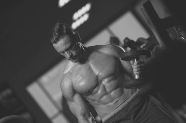 istock Strong mature man working out in the gym 945439302