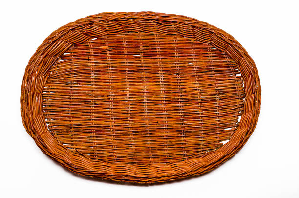 istock Round wicker basket of brown color on a white background 945439408
