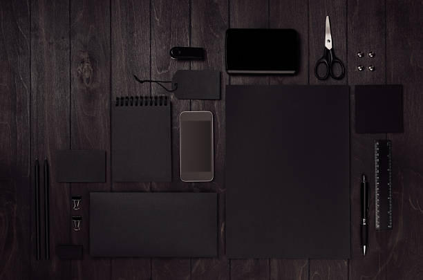 istock Luxury corporate identity template with black blank paper stationery set, phone on dark elegans wood board. 945451368