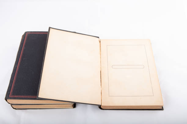 istock Open and closed old books  isolated on white 945452590