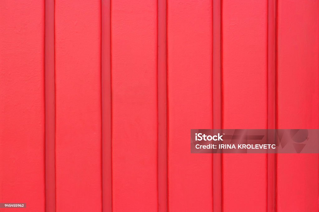 Wall from wooden planks or slats, background texture wall made of wooden planks or strips, red color. background, texture Metal Stock Photo