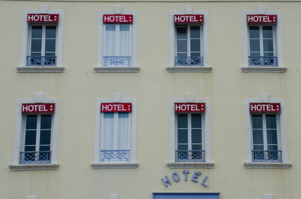istock Hotel frontage with lots of signs 945463460
