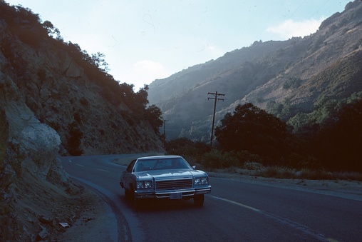 California, USA, 1976. Car on a highway in the California hills.