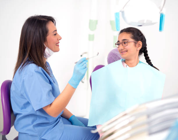 istock Female dentist with little patient 945470188