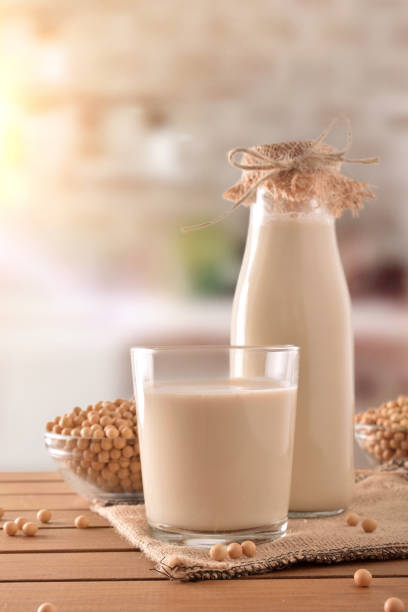 istock Reptientes with soy milk and grains rustic kitchen background vertical 945475098