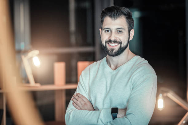 istock Handsome glad man waiting for you 945479666
