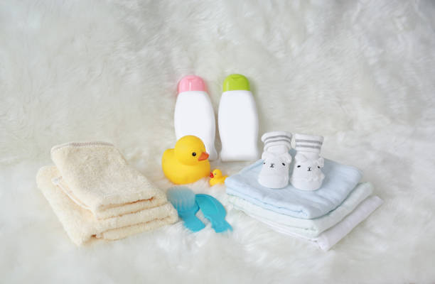 istock Children's bath products and hygiene items on white fur. 945495620