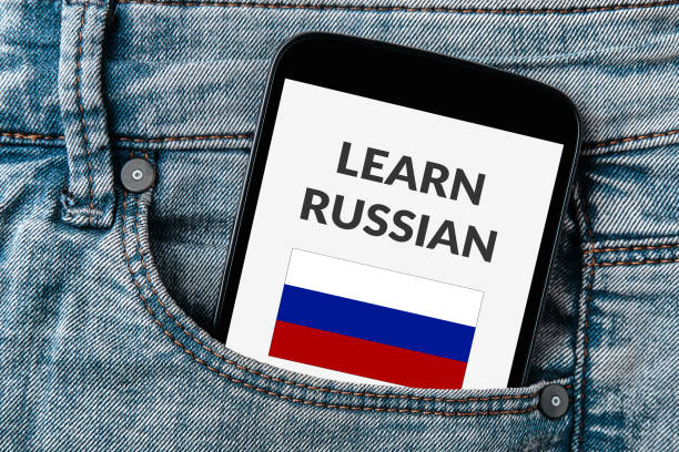 istock Learn Russian concept on smartphone screen in jeans pocket 945498552