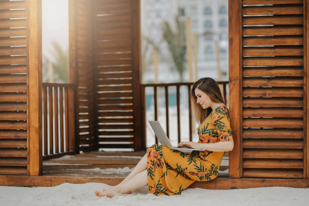istock Young woman working on laptop 945499102