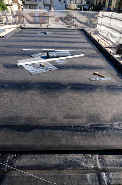 istock laying of waterproofing sheathing  and insulation on a roof 945517850