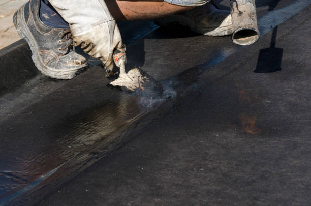 istock laying of waterproofing sheathing  and insulation on a roof 945517866