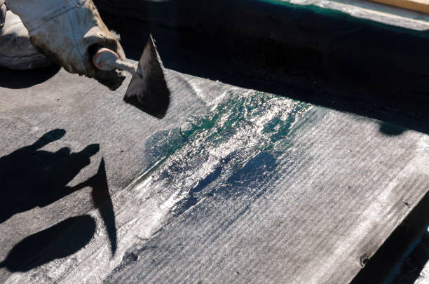 istock laying of waterproofing sheathing  and insulation on a roof 945519938