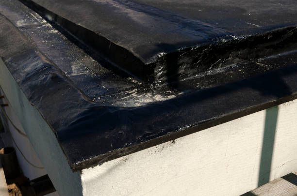 istock laying of waterproofing sheathing  and insulation on a roof 945519994