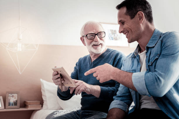 istock Happy positive man pointing at the photo 945525166