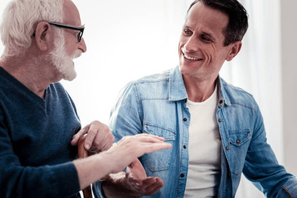 istock Cheerful delighted father and son having a good time 945526386